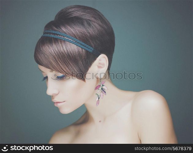 Portrait of young beautiful lady with earring