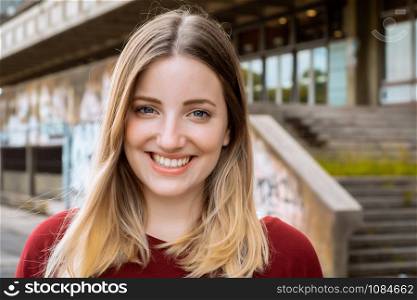 Portrait of young beautiful woman Outdoors. Urban concept.