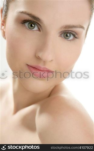 Portrait of young beautiful woman with clean skin at studio