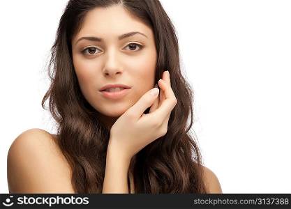 Portrait of young beautiful woman with hand