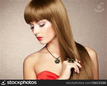 Portrait of young beautiful woman with jewelry. Beauty photo