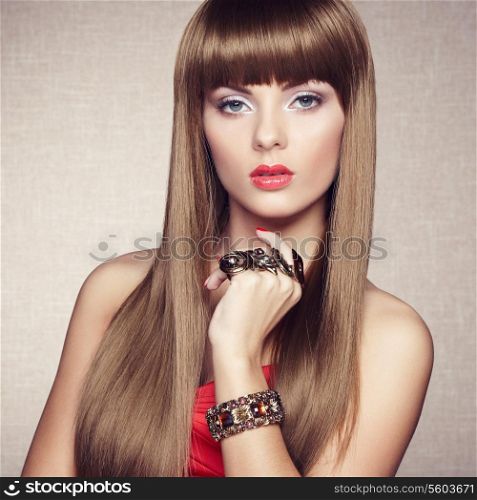 Portrait of young beautiful woman with jewelry. Beauty photo