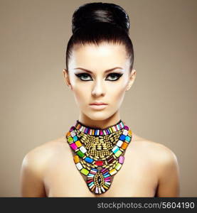 Portrait of young beautiful woman with jewelry. Beauty photo