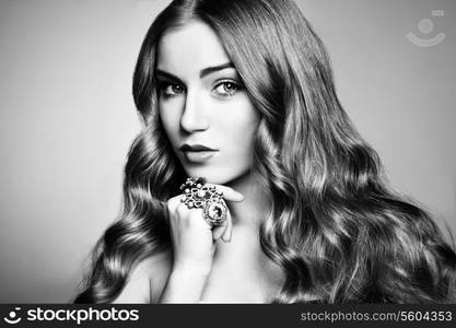 Portrait of young beautiful woman with jewelry. Beauty photo