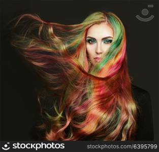 Portrait of young beautiful woman with long flowing hair. Model with perfect Healthy Dyed Hair. Rainbow Hairstyles
