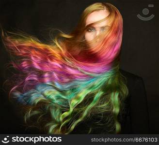 Portrait of young beautiful woman with long flying hair. Portrait of young beautiful woman with long flowing hair. Model with perfect Healthy Dyed Hair. Rainbow Hairstyles