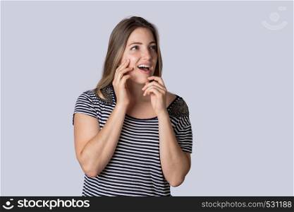 Portrait of young beautiful woman with surprised expression.