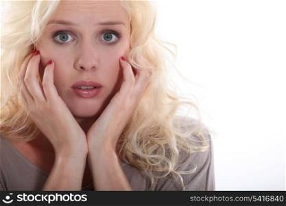 portrait of young blonde looking scared