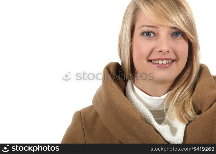 Portrait of young blonde with coat