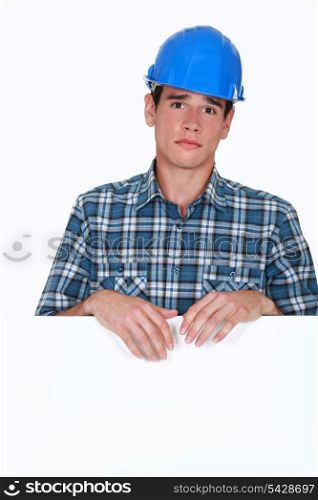 portrait of young blue collar posing behind copyspace