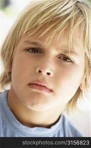 Portrait Of Young Boy Frowning
