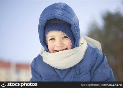 Portrait of young boy in the snow