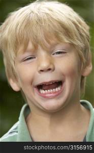 Portrait Of Young Boy Laughing