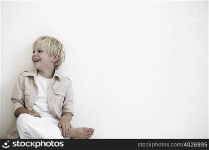 Portrait of young boy laughing