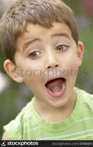 Portrait Of Young Boy Looking Surprised