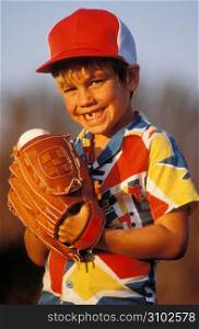 Portrait of young boy playing baseball