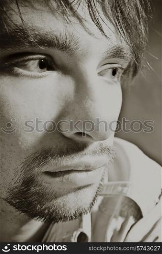 Portrait of young brunette man close up