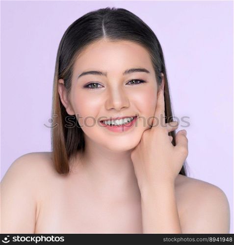 Portrait of young brunette with long hair and flawless skin with hand gesture for beauty and cosmetic concept. charming beautiful young girl posing hands for skincare or cosmetic advertising.. charming girl with flawless skin portrait for beauty and cosmetic concept.