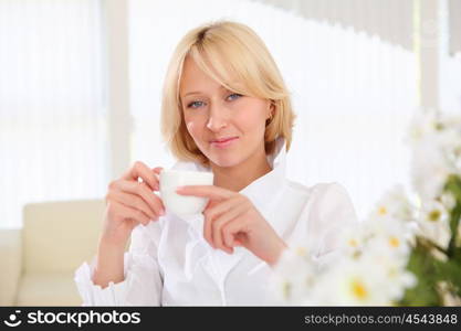 portrait of young business lady holding a tea cup