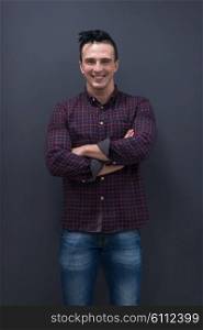 portrait of young business man in casual clothes grey wall in background