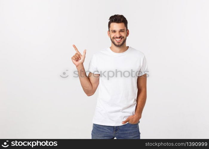 Portrait of young business man in suit pointing at copy space over white background. Portrait of young business man in suit pointing at copy space over white background.