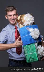 Portrait of young business man with gifts