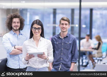 Portrait of young business people discussing business plan in the startup office