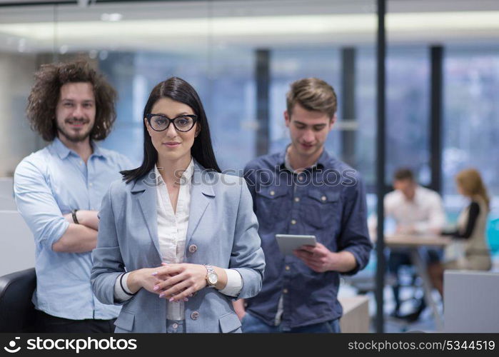 Portrait of young business people discussing business plan in the startup office