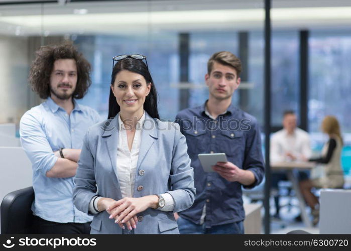 Portrait of young business people discussing business plan in the startup office