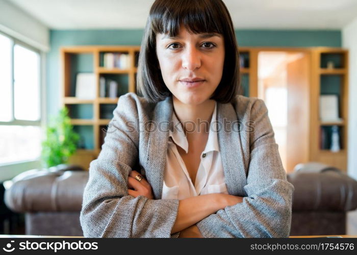 Portrait of young business woman on video call from home. Business woman working from home. New normal lifestyle.