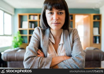 Portrait of young business woman on video call from home. Business woman working from home. New normal lifestyle.