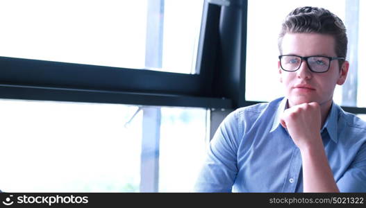 portrait of young businessman at startup office