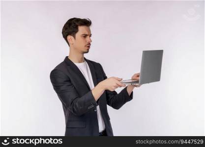 Portrait of young businessman has computer problems and is holding a laptop isolated on white background. Technology and business concept.
