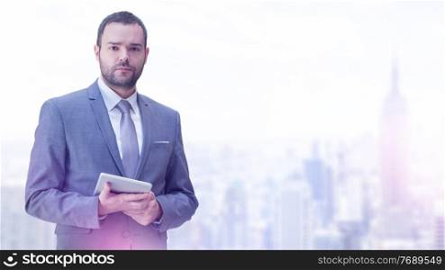 Portrait of young businessman in front of his modern office