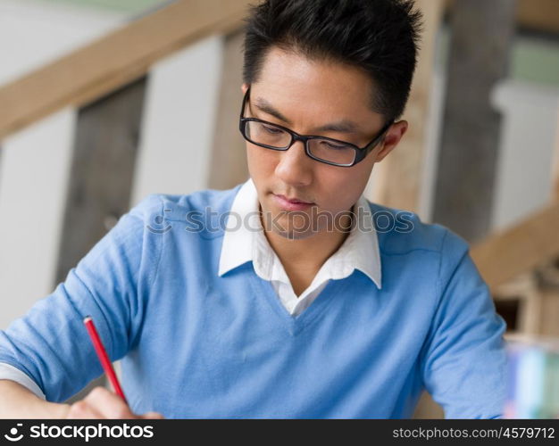 Portrait of young businessman in office. Portrait of young businessman