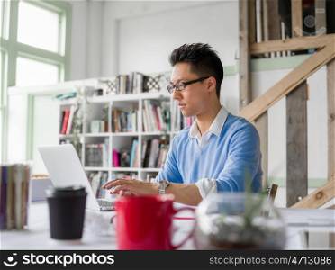 Portrait of young businessman in office. Portrait of young businessman