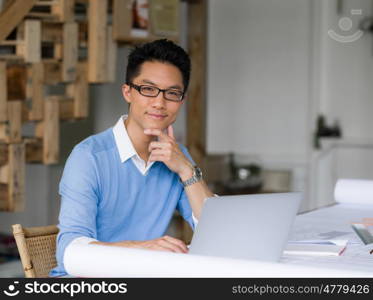 Portrait of young businessman in office. Portrait of young businessman