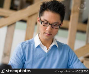 Portrait of young businessman in office. Portrait of young businessman