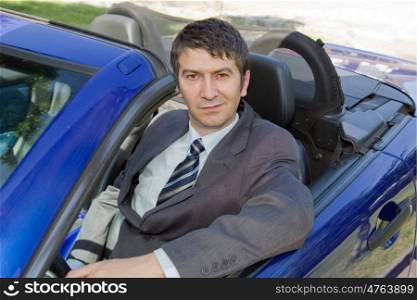 Portrait of young businessman in the car