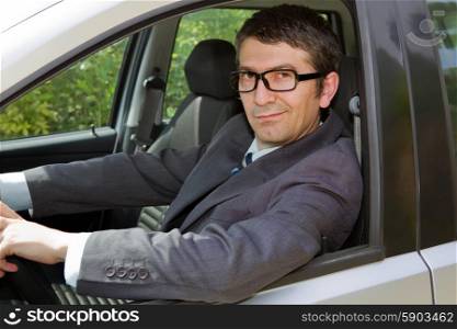 Portrait of young businessman in the car