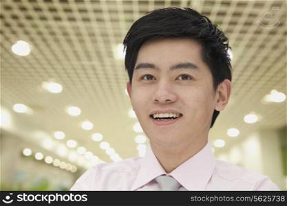 Portrait of young businessman indoors, Beijing