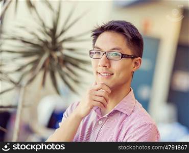 Portrait of young businessman. Portrait of young businessman standing in office