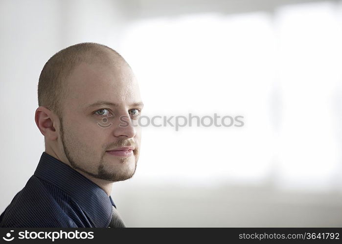 Portrait of young businessman smiling