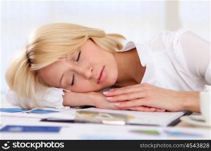 portrait of young businesss woman sleeping at work
