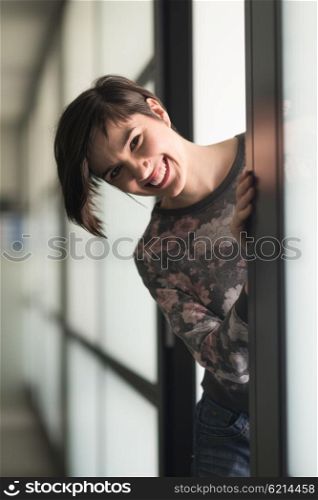 portrait of young businesswoman in casual hipster clothes at modern startup business office interior