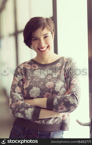portrait of young businesswoman in casual hipster clothes at modern startup business office interior