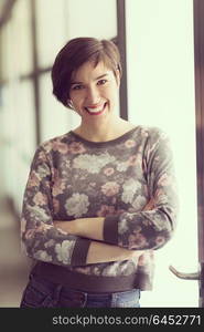 portrait of young businesswoman in casual hipster clothes at modern startup business office interior