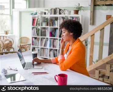Portrait of young businesswoman in office holding her mobile. Portrait of young businesswoman with mobile