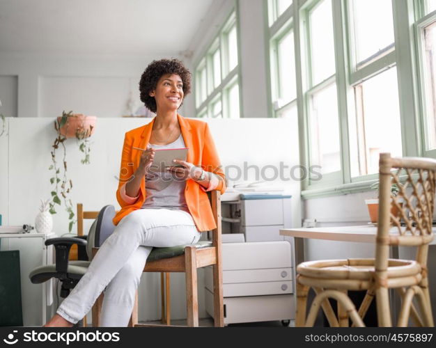 Portrait of young businesswoman in office. Portrait of young businesswoman