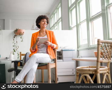 Portrait of young businesswoman in office. Portrait of young businesswoman